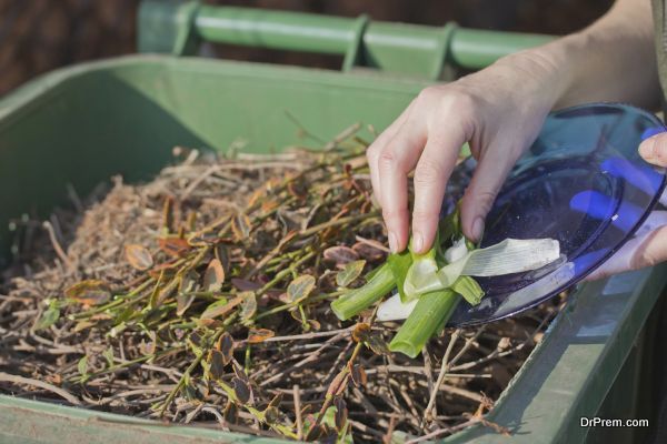 Sacking of organic waste into a green bins