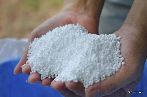 Urea,nitrogen chemical fertilizer on farmer hand