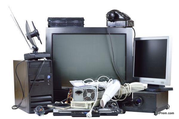 Old and used electric home waste. Obsolete pc computer, telephone, CRT monitor, DVD.