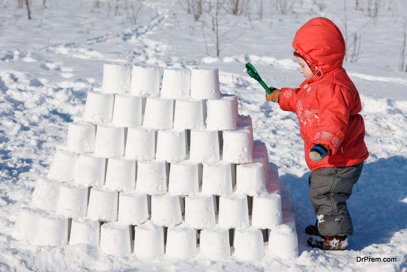 child making snow castle