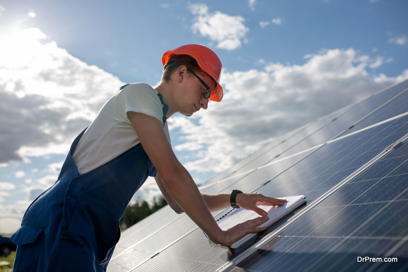 Employee working at solar energy station