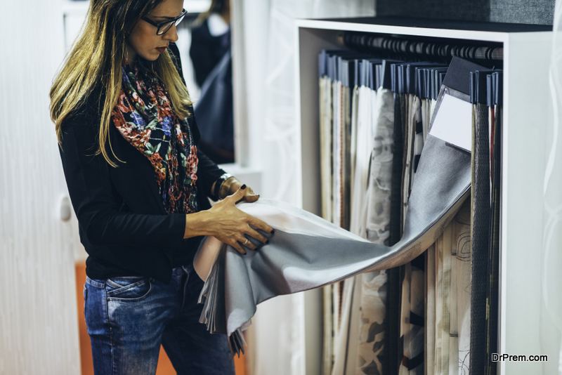 Designer choosing fabric for curtains