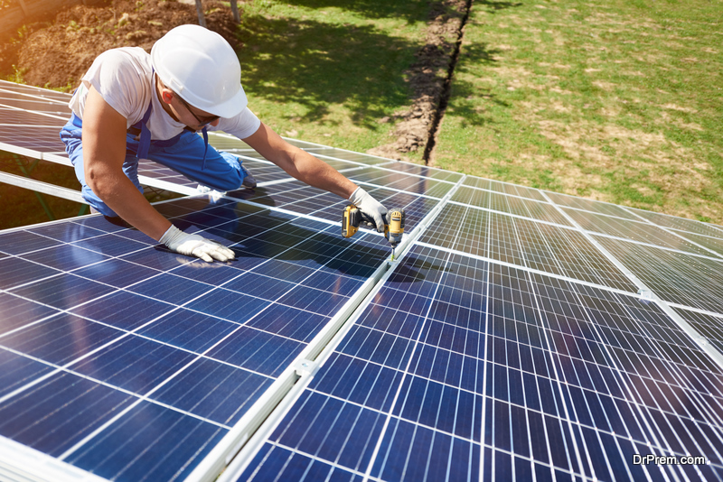 Professional worker installing solar panels
